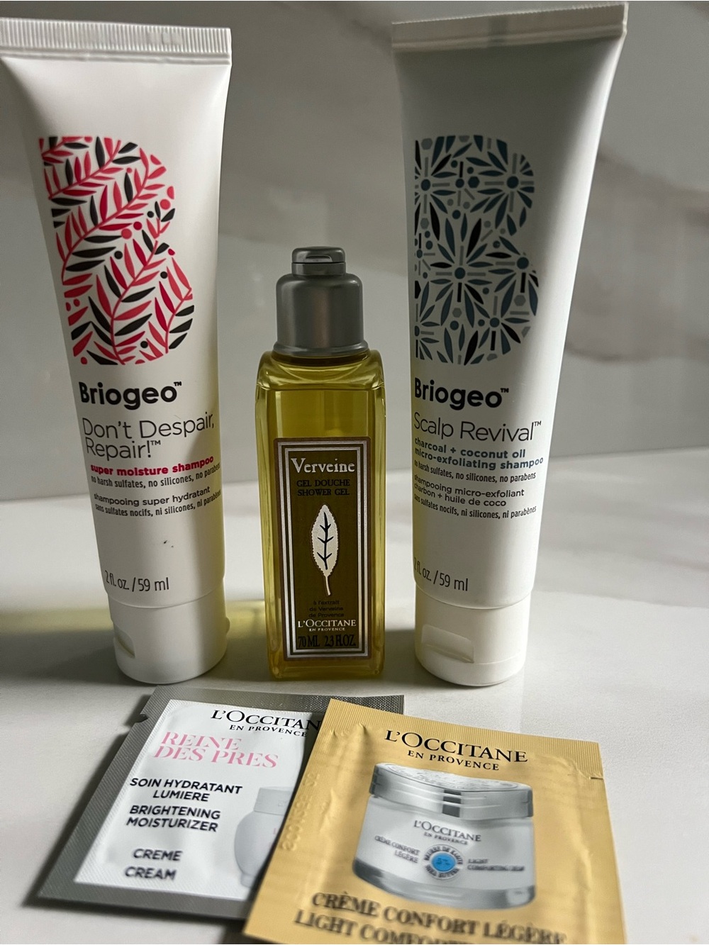 L'Occitane travel body wash plus Briogeo travel shampoo & other samples